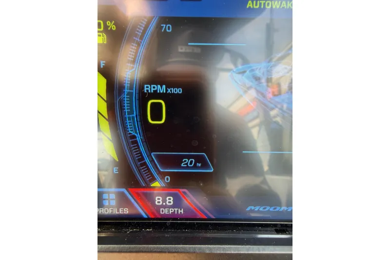 Slide: The Image of Dashboard display of 2025 Moomba Makai boat showing RPM and depth readings. - 24