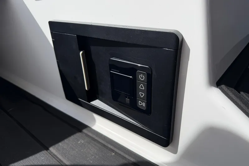 Slide: The Image of Control panel on 2025 Moomba Makai boat, featuring sleek black design and modern interface. - 26