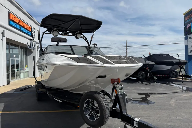 Slide: The Image of 2025 Moomba Makai boat on trailer at Performance Marine dealership. - 9