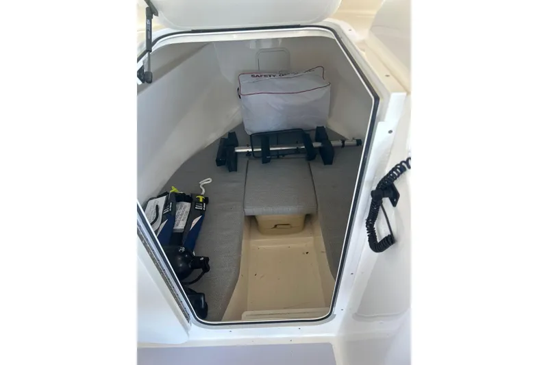 Slide: The Image of 2024 NorthCoast 235 HT cabin interior with safety gear and equipment storage. - 11