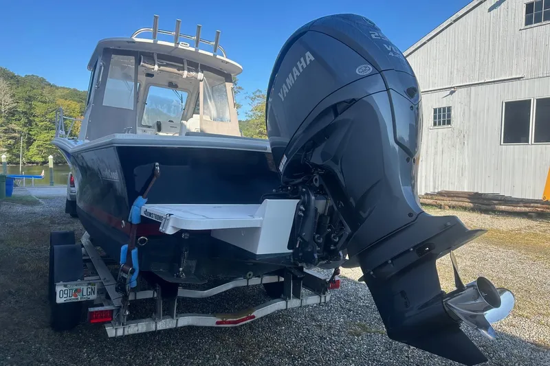 Slide: The Image of 2024 NorthCoast 235 HT boat with Yamaha outboard motor on a trailer. - 3