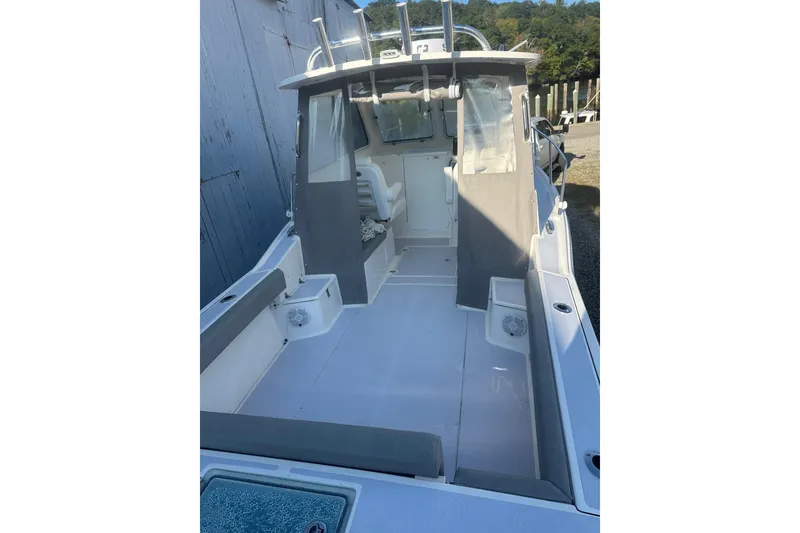 Slide: The Image of 2024 NorthCoast 235 HT boat interior, featuring spacious seating and modern design. - 4