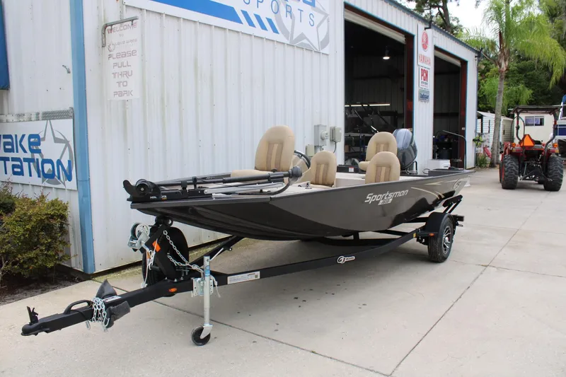 Slide: The Image of 2025 G3 Sportsman 1610 boat on trailer outside dealership. - 4