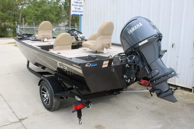Slide: The Image of 2025 G3 Sportsman 1610 boat with Yamaha motor on trailer, parked outdoors. - 6