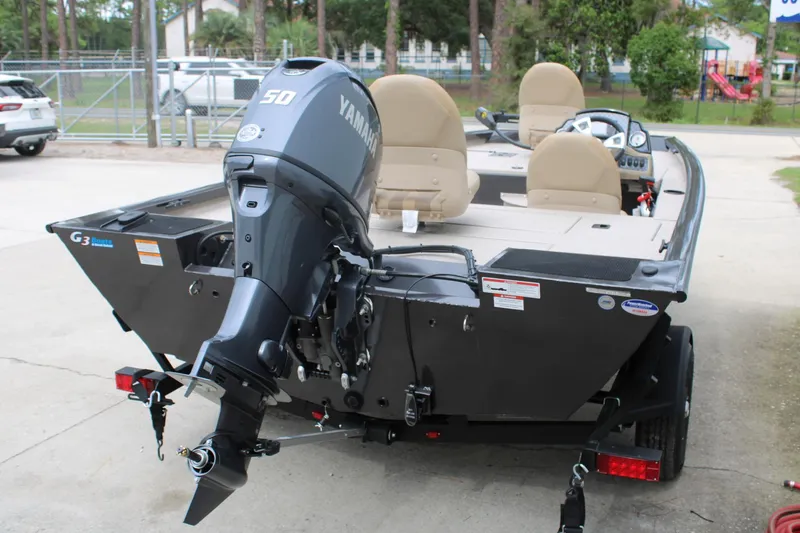 Slide: The Image of 2025 G3 Sportsman 1610 boat with Yamaha 50 engine, parked outdoors. - 9