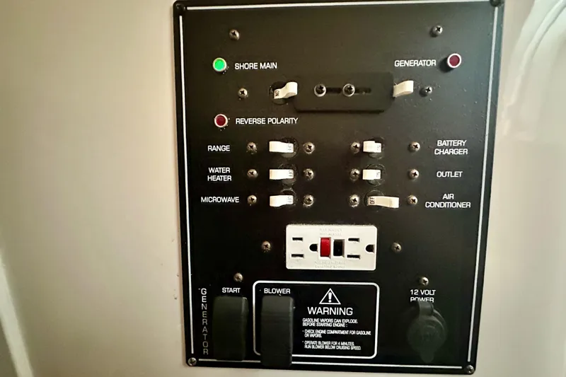Slide: The Image of Electrical control panel on a 2001 Rinker Fiesta Vee 270 boat. - 14