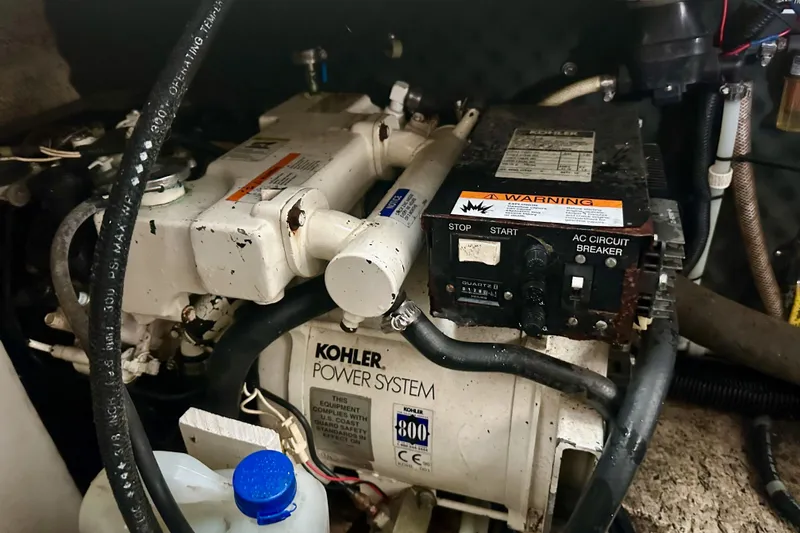 Slide: The Image of Engine compartment of a 2001 Rinker Fiesta Vee 270 with Kohler power system. - 18