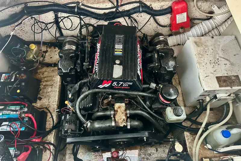 Slide: The Image of Engine compartment of a 2001 Rinker Fiesta Vee 270 with a 5.7L Mercury engine. - 19
