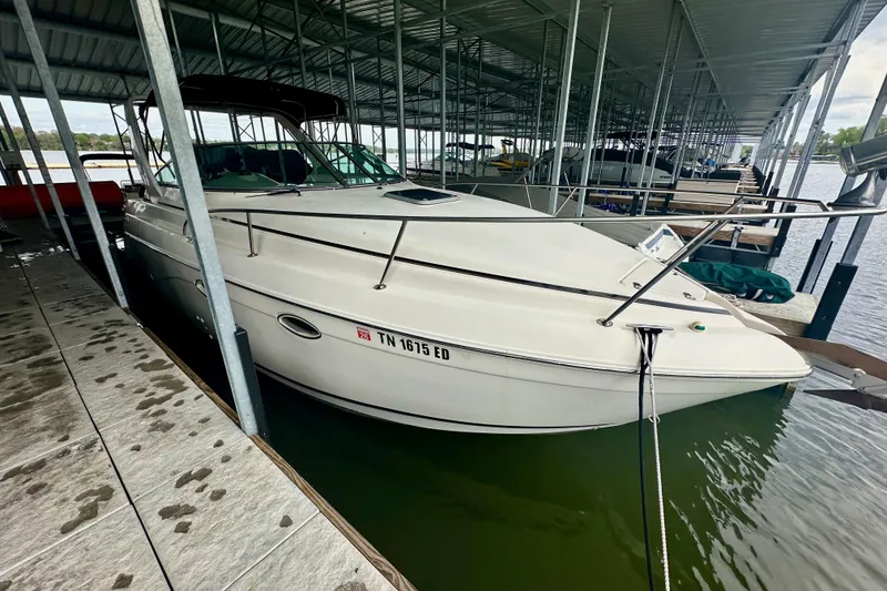 Slide: The Image of 2001 Rinker Fiesta Vee 270 boat docked in covered marina. - 4