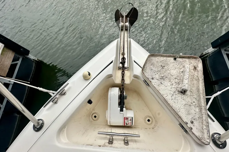 Slide: The Image of Bow of 2001 Rinker Fiesta Vee 270 with anchor and open hatch. - 5