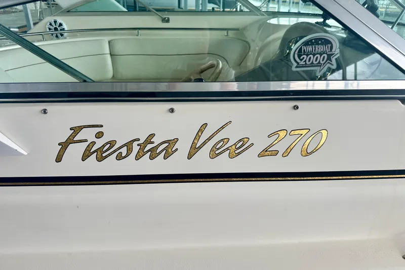Slide: The Image of 2001 Rinker Fiesta Vee 270 boat with gold lettering and Powerboat 2000 sticker. - 6