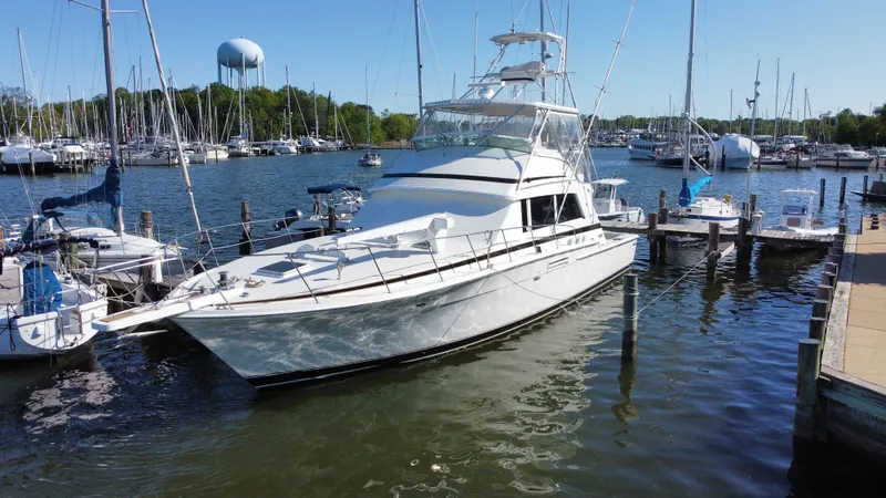 The Image of 1986 Bertram 54 Convertible Yacht docked in marina. - 0