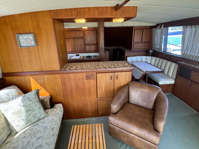 Slide: The Image of Interior of 1986 Bertram 54 Convertible yacht with cozy seating area. - 36