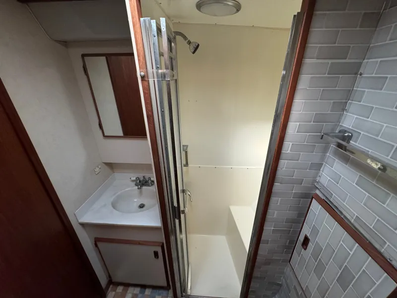 Slide: The Image of Bathroom in 1986 Bertram 54 Convertible with shower and sink. - 47