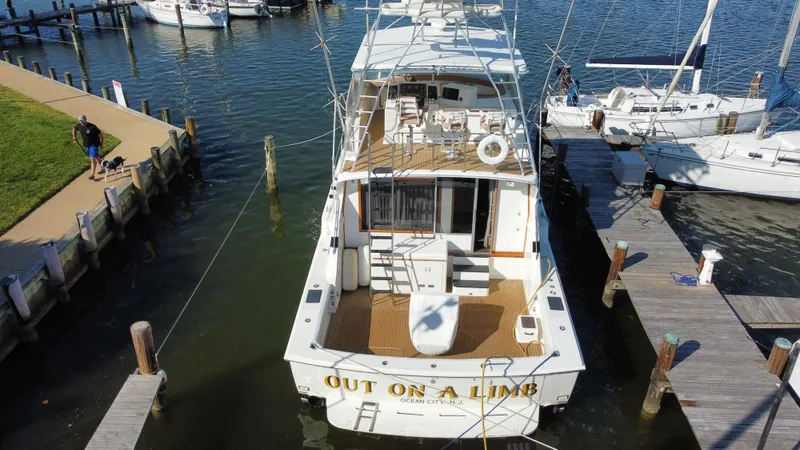Slide: The Image of Aerial view of a 1986 Bertram 54 Convertible yacht docked in harbor. - 7