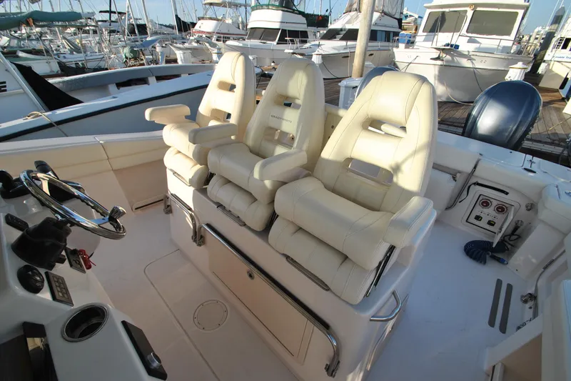 Slide: The Image of 2021 Grady-White Canyon 336 boat interior with three plush captain's chairs. - 10