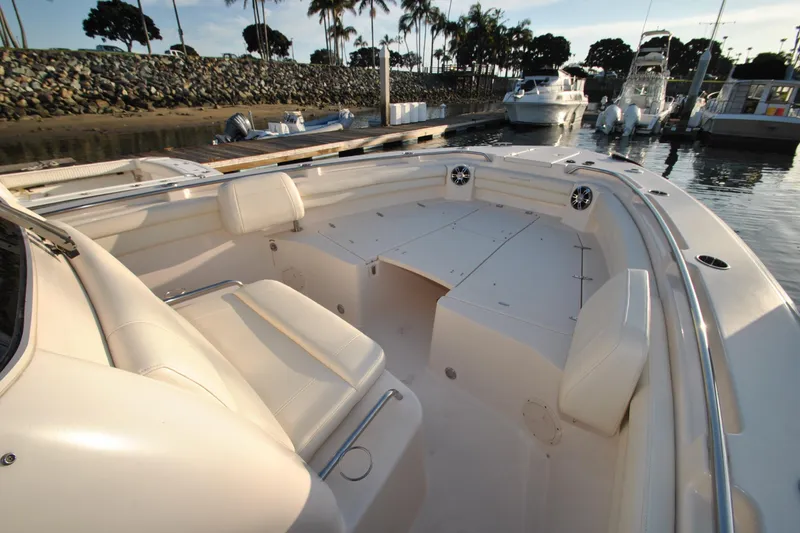 Slide: The Image of 2021 Grady-White Canyon 336 boat interior with seating, docked at marina. - 19