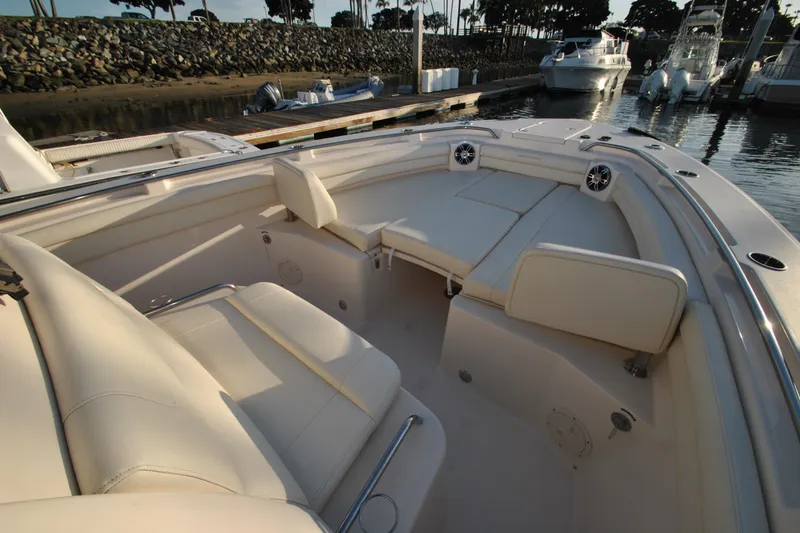 Slide: The Image of 2021 Grady-White Canyon 336 boat interior with luxurious seating and waterfront view. - 22