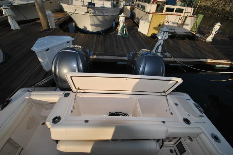 Slide: The Image of 2021 Grady-White Canyon 336 boat at dock with open storage compartment. - 26
