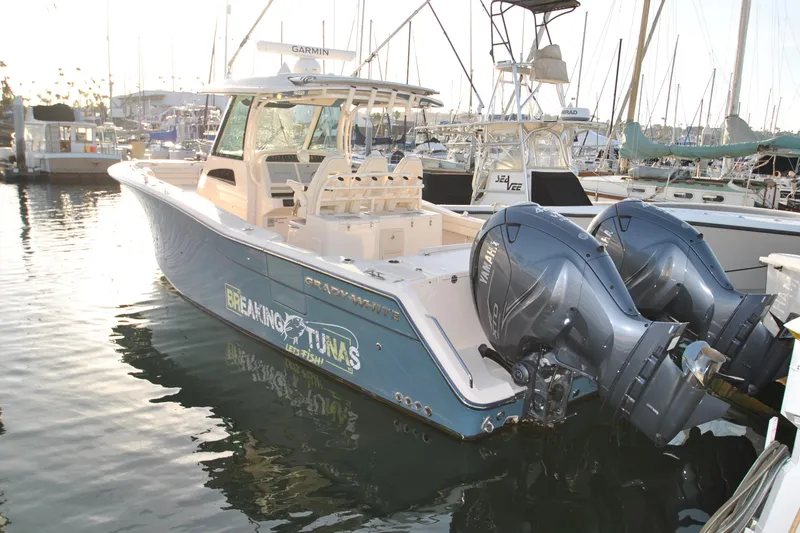 Slide: The Image of 2021 Grady-White Canyon 336 boat docked with twin Yamaha engines. - 3