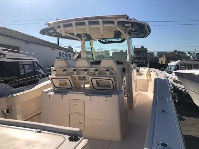 Slide: The Image of Grady-White Canyon 336 boat, 2021 model, docked under sunny skies. - 32