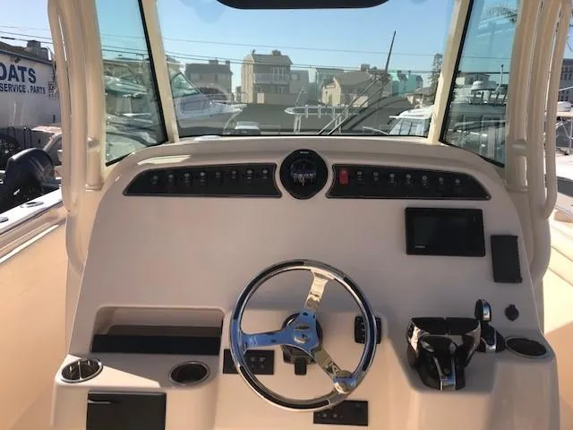 Slide: The Image of Interior view of Grady-White Canyon 336 helm, year 2021. - 36