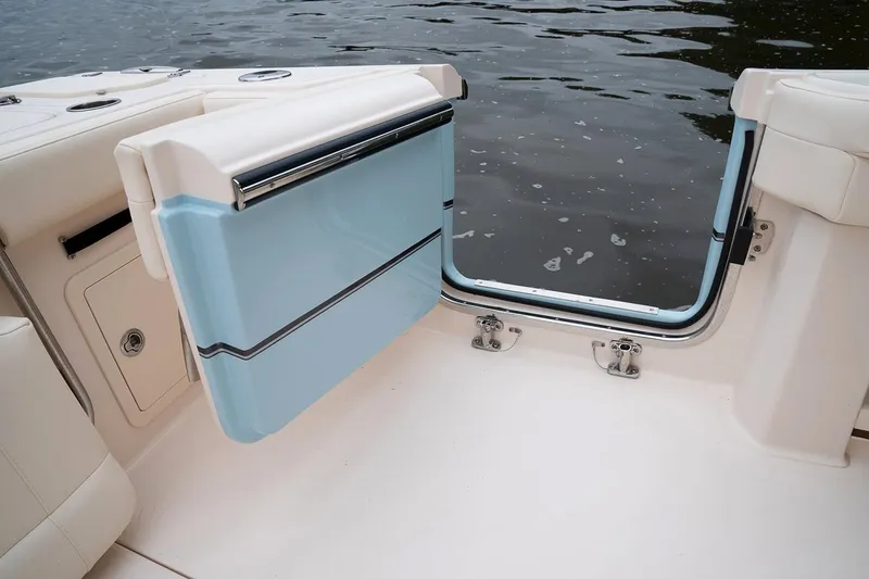 Slide: The Image of 2021 Grady-White Canyon 336 with open door by the water. - 38