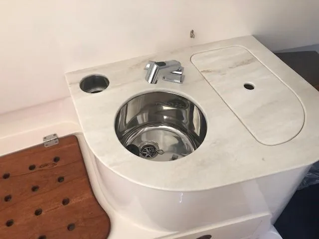 Slide: The Image of Grady-White Canyon 336 2021 boat kitchenette with stainless steel sink. - 40