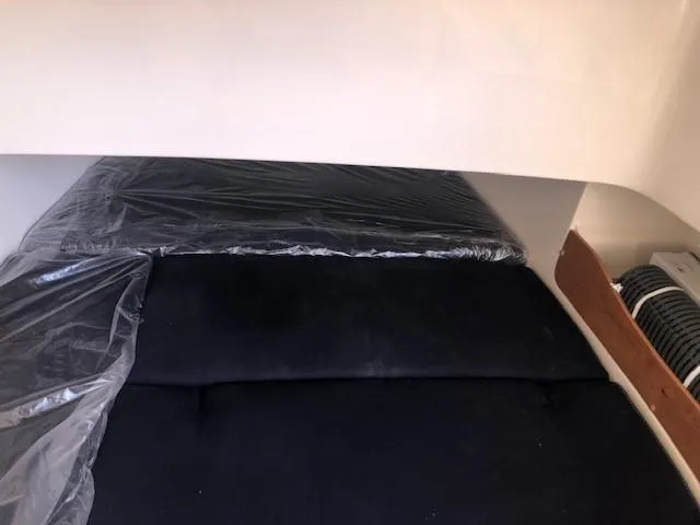 Slide: The Image of Interior of 2021 Grady-White Canyon 336 with black cushions. - 43