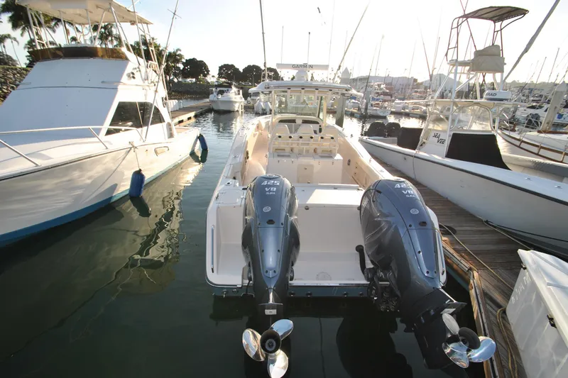 Slide: The Image of 2021 Grady-White Canyon 336 boat docked with twin outboard engines. - 6