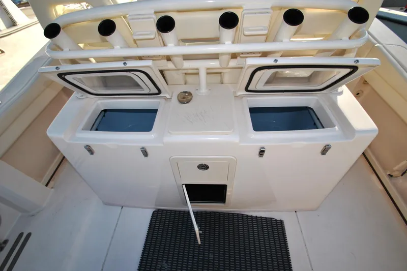 Slide: The Image of 2021 Grady-White Canyon 336 fishing station with rod holders and storage compartments. - 9