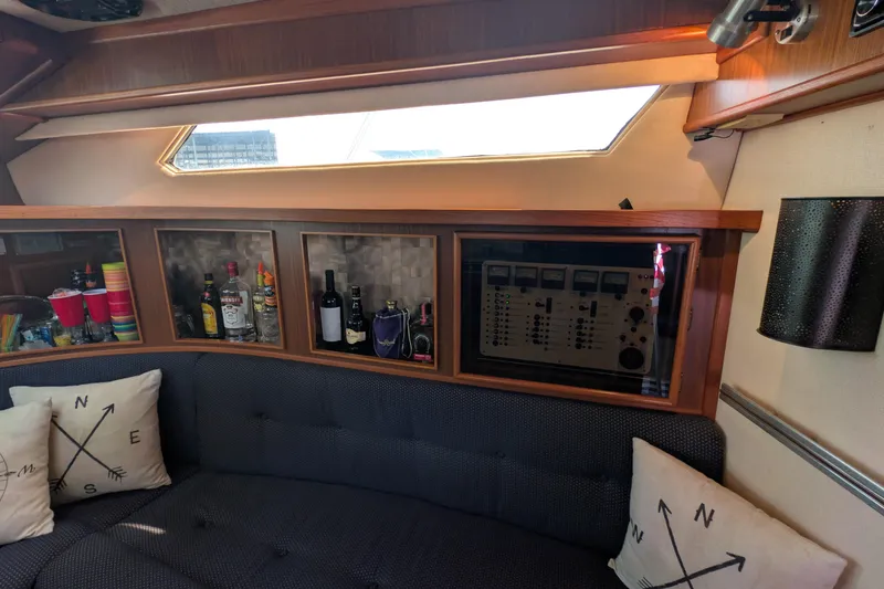 Slide: The Image of Interior of 1987 Sea Ray 390 Express Cruiser with bar and control panel. - 23