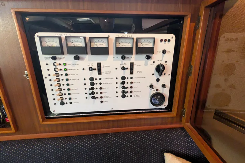 Slide: The Image of Electrical control panel of a 1987 Sea Ray 390 Express Cruiser boat. - 45