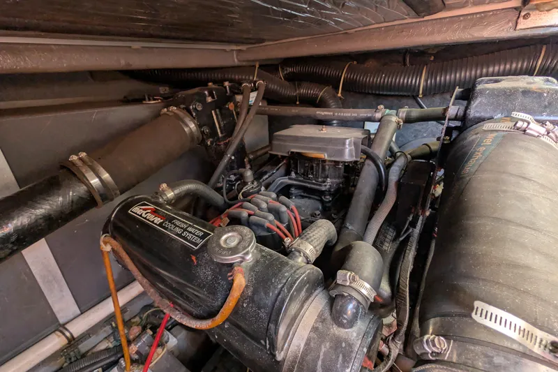 Slide: The Image of Engine compartment of a 1987 Sea Ray 390 Express Cruiser with MerCruiser cooling system. - 53