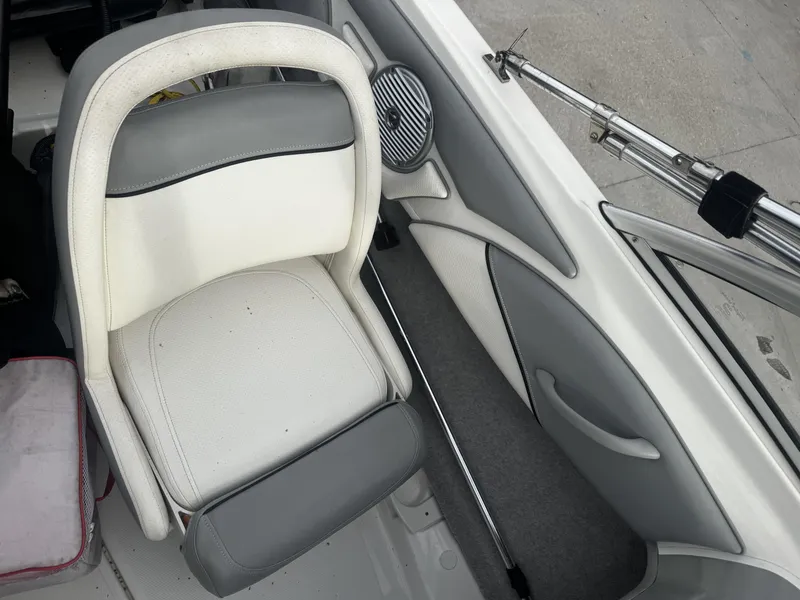 Slide: The Image of Interior of a 2011 Bayliner 184 boat, featuring seat and speaker. - 7