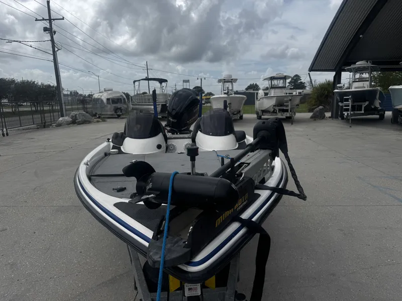 Slide: The Image of 2006 Stratos 285 Pro XL boat in a parking area. - 11