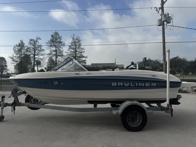 Slide: The Image of 2006 Stratos 285 Pro XL boat on trailer outside showroom. - 3