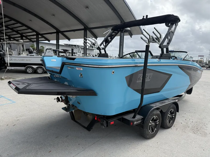 Slide: The Image of 2023 Heyday WT-2DC boat on trailer at a marina. - 12