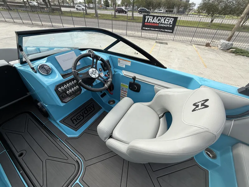 Slide: The Image of Interior of a 2023 Heyday WT-2DC boat with blue dashboard. - 14