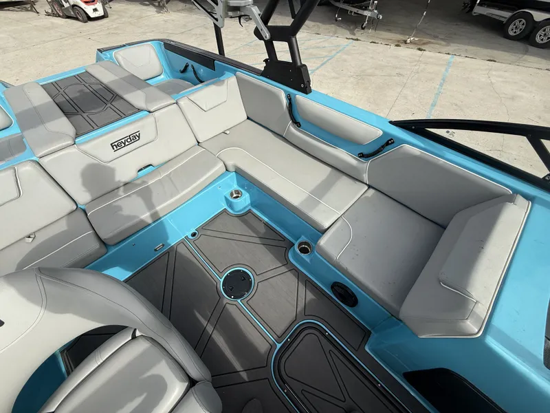 Slide: The Image of Interior of 2023 Heyday WT-2DC with gray and blue seating. - 15