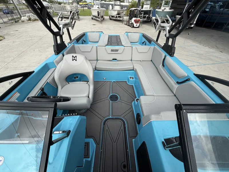 Slide: The Image of Interior of a 2023 Heyday WT-2DC boat with blue and gray seating. - 4