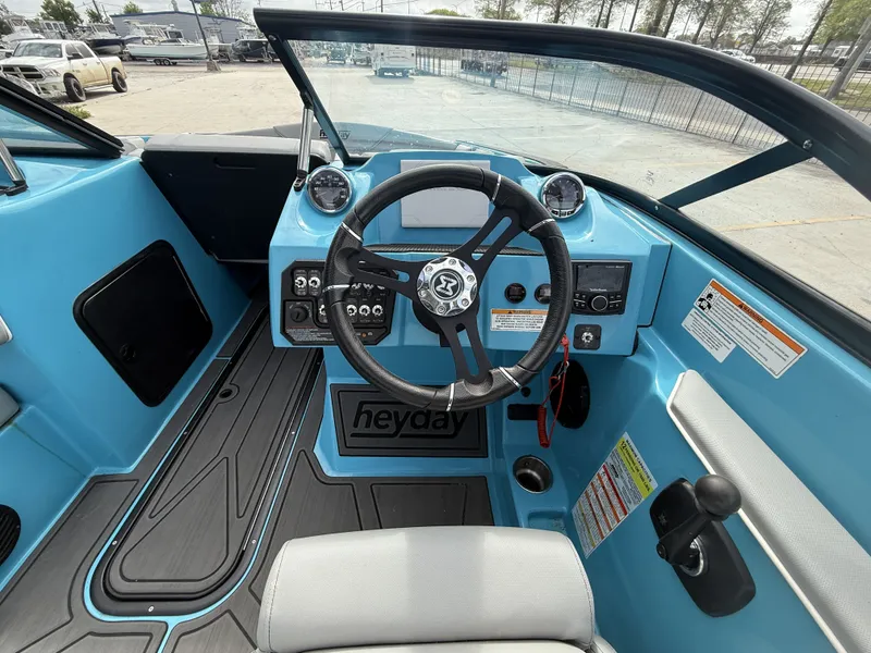 Slide: The Image of Interior view of 2023 Heyday WT-2DC boat cockpit with steering wheel. - 5