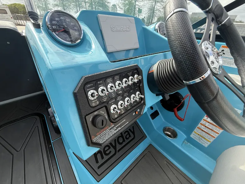 Slide: The Image of Dashboard of a 2023 Heyday WT-2DC boat with steering wheel and controls. - 6