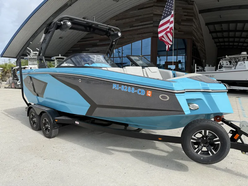 Slide: The Image of 2023 Heyday WT-2DC boat on trailer outside warehouse. - 9