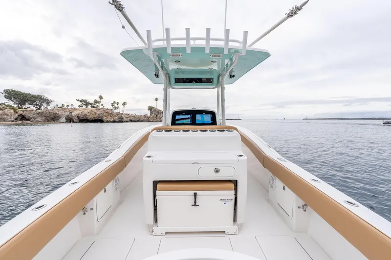 Slide: The Image of 2015 Mag Bay 33 CC boat interior with helm, ocean view, and sleek design. - 12