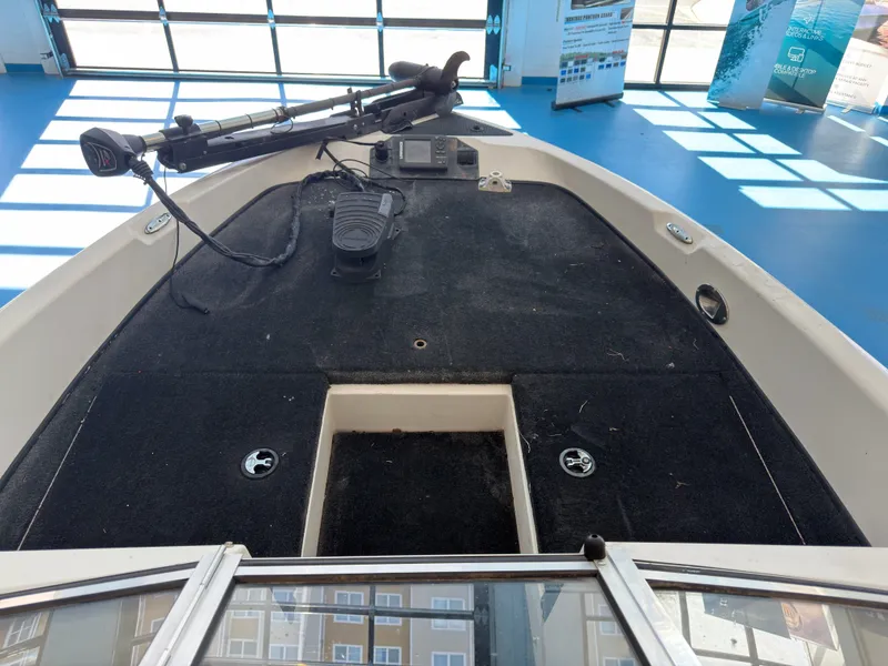 Slide: The Image of Interior view of a 2015 Triton 210 Escape boat. - 10