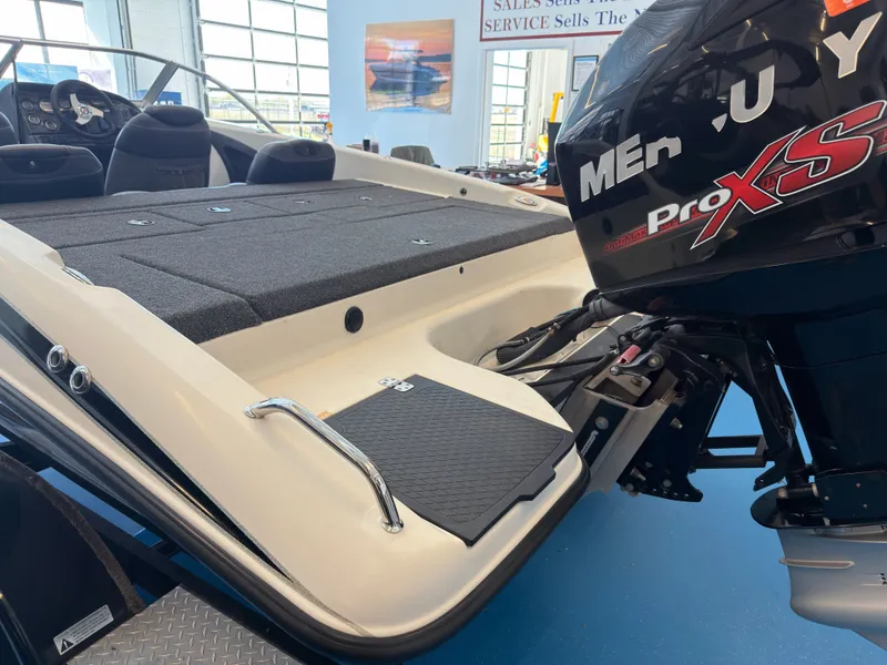 Slide: The Image of Triton 210 Escape 2015 with Mercury ProXS engine in showroom. - 11