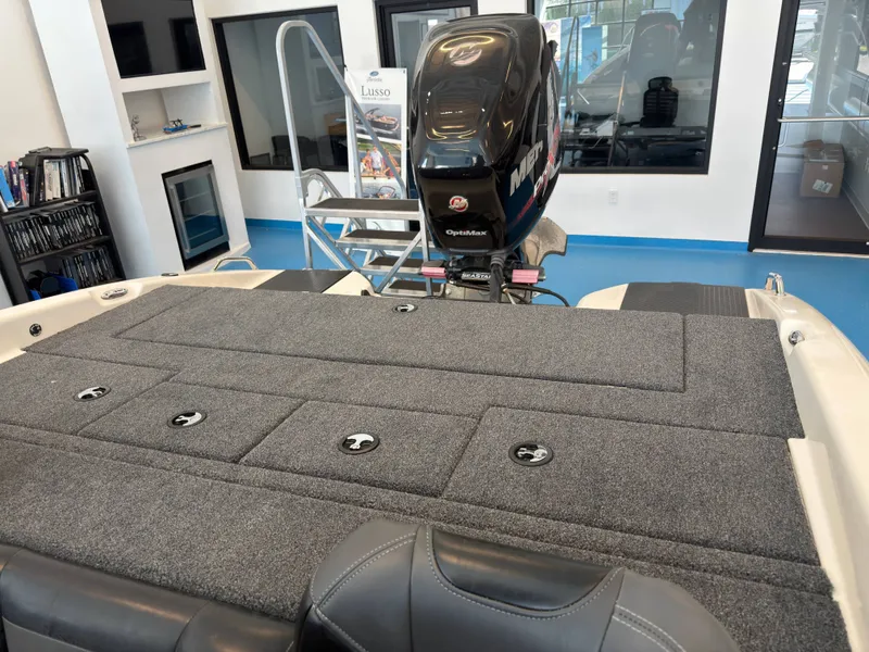 Slide: The Image of 2015 Triton 210 Escape boat with motor in showroom. - 18