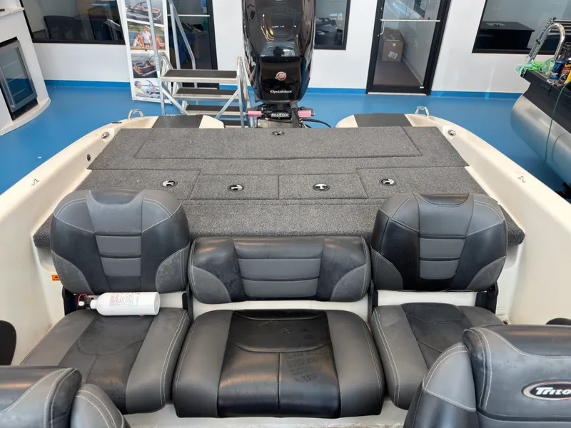 Slide: The Image of Interior of a 2015 Triton 210 Escape boat with gray seating. - 27