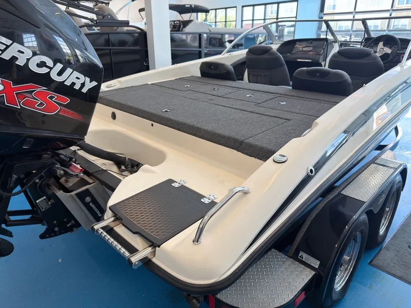 Slide: The Image of 2015 Triton 210 Escape boat with Mercury engine in showroom. - 5